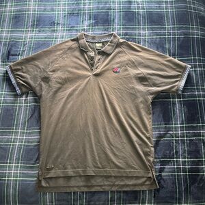 Y2K 2000s Nike black polo shirt with blue checkered collar and embroidered logo